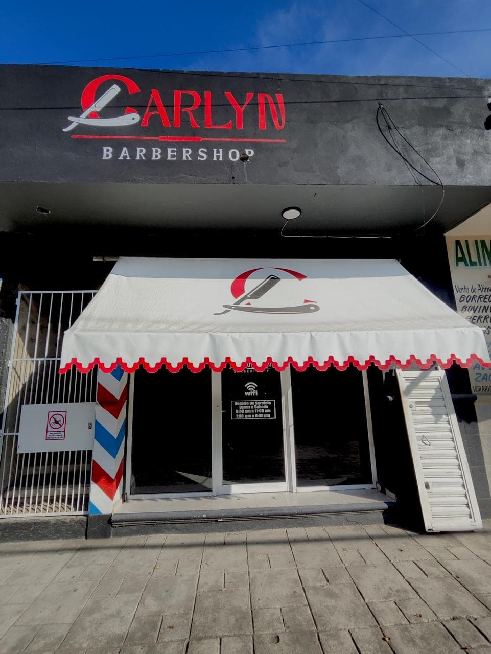 Fachada oficial exterior y rótulo de Barbería Carlyn sucursal Aviación Civil en Huejutla
